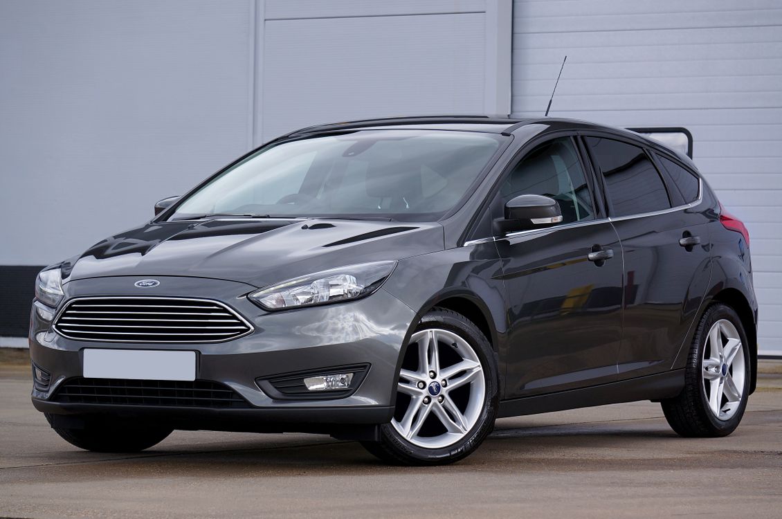 Front headlamps of a grey Ford Focus photographed in Scotland